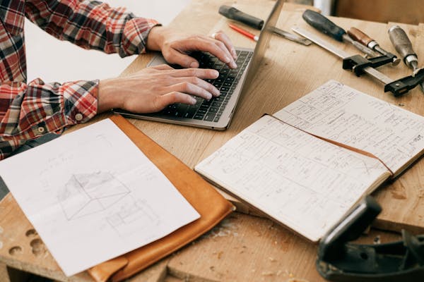 HVAC professional reviewing system notes and scheduling
